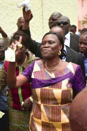 Former Ivory Coast first lady Simone Gbagbo, arriving at home last August after being amnestied by President Ouattara.  By ISSOUF SANOGO (AFP)