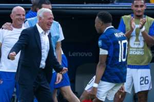 France coach Didier Deschamps celebrates with Kylian Mbappe after the forward scored against Sweden.  By Pedro UGARTE (AFP)