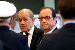 French Defence Minister Jean-Yves Le Drian (L) and President Francois Hollande pictured during at a meeting of coalition defence chiefs at the Defence Ministry in Paris, on October 25, 2016