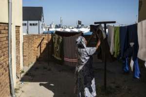 From Alexandras mainly black township citizens can see Johannesburgs wealthy Sandton business district and suburbs populated by often white South Africans.  By EMMANUEL CROSET (AFP)