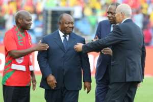 Gabons President Ali Bongo Ondimba (C) speaks with Guinea-Bissaus President Jose Mario Vaz (L) and CAF president Issa Hayatou (2nd-R) before the 2017 Africa Cup of Nations match between Gabon and Guinea-Bissau on January 14, 2017
