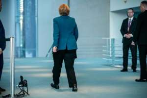 German Chancellor Angela Merkel began quarantining at home after being treated by a doctor who has since tested positive for the virus.  By Michael Kappeler (AFP)