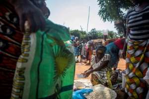 Grains, chickens, fish and other seafood are the most popular goods exchanged at the barter market where most business is conducted in the open.  By Yanick Folly (AFP)