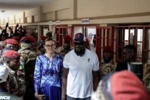 Guinea junta leader Mamady Doumbouya and his wife Lauriane are seen after casting their ballots in the September constitutional referendum.  By Patrick MEINHARDT (AFP/File)