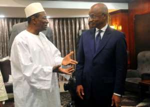 Guinean opposition leader Cellou Dalein Diallo (R), seen here in April speaking with President Alpha Conde whom he accuses of violating the constitution by banning demonstrations.  By CELLOU BINANI (AFP)