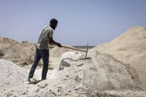Harvesting and selling the salt from the lake waters is a lucrative sideline.  By PATRICK MEINHARDT (AFP)
