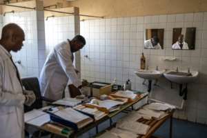 Health workers say that some locals remain sceptical about the safety of the insecticide spray.  By EMMANUEL CROSET (AFP)