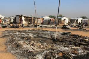 Houses have been left burnt by Boko Haram attacks.  By AUDU MARTE (AFP)