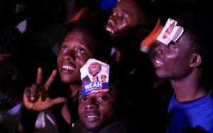 Hundreds of supporters of George Weah took to the streets of Monrovia, singing, dancing and embracing each other as news of his win in Liberias presidential vote spread