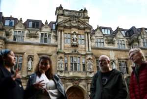 In Oxford, tourists are shown the statue of British coloniser Cecil Rhodes.  By HENRY NICHOLLS (AFP)