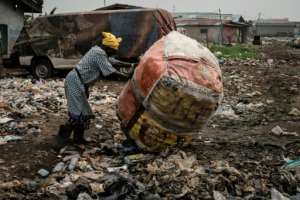In the Mosafejo area of Lagos, plastic waste is being used to fill a swamp so that the land can be developed for housing. By Yasuyoshi CHIBA (AFP)