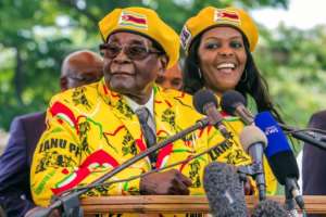 In their pomp: The Mugabes, seen among supporters last November after Grace Mugabe engineered the dismissal of Emmerson Mnangagwa as vice president. The move was politically fatal for the Mugabes, for it triggered the army intervention