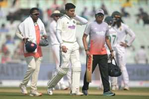 India captain Shubman Gill (C) retired hurt with a neck injury that kept him out of the remainder of the second days play at Eden Gardens.  By DIBYANGSHU SARKAR (AFP)
