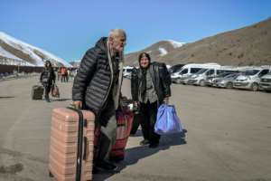 Iranian nationals arrive in Turkey after passing through the Razi-Kapiky border crossing in Van, north-eastern Turkey.  By Ali IHSAN OZTURK (AFP)