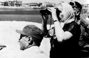 Israeli Prime Minister Golda Meir looks over to the Egyptian side of the Suez Canal in 1970, during the war.  By RADIOPHOTO (AFP)