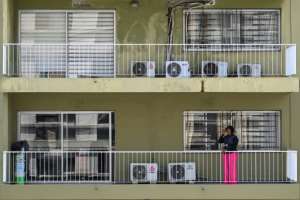 Ivorians see no problem with using aircon in the heat, despite concerns about greenhouse gases.  By Issouf SANOGO (AFP)