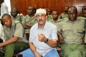 Ivory Kingpin Feisal Mohamed Ali (C), pictured August 3, 2018, had his 20-year jail term overturned due to gaps in the evidence against him -- something the researchers hope their work will prevent in the future.  By Andrew KASUKU (AFP/File)