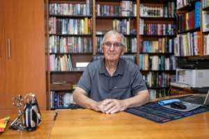 Jan Groenewald, one of Kleinfonteins founding members, poses for a photograph in his study at his home in Kleinfontein regulations..  By Wikus de Wet (AFP)