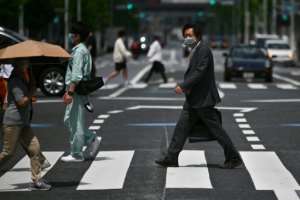 Japan -- the worlds third largest economy -- lifted a state of emergency across most of the country except for Tokyo and Osaka.  By Charly TRIBALLEAU (AFP)