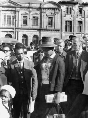 June 16, 1964: Her fist clenched, Winnie Mandela leaves Pretorias Palace of Justice after the Rivonia Trial, a landmark in the struggle against apartheid. Nelson Mandela was among eight men sentenced to life for conspiracy, sabotage and treason