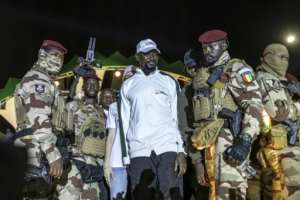 Junta leader Mamady Doumbouya (C) had initially pledged not to stand for office.  By PATRICK MEINHARDT (AFP)