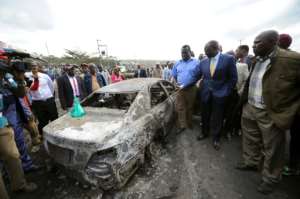 Kenyan Vice President William Ruto (2nd right) visits the crash site near Karai, on the busy Naivasha highway