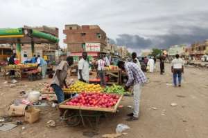 Khartoum residents take advantage of a lull in fighting in the first few hours of Saturdays truce to stock up on fruit and other basic goods that have been in short supply.  By - (AFP)