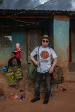 Lazarus Chigwandali, outside his home in Malawi, is about to release his first professional album.  By AMOS GUMULIRA (AFP)
