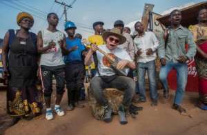 Lazarus Chigwandali, performing in Lilongwes Area 3 Market, says he hopes his music gives a voice to people with albinoism, so they understand theyre as worthy as any other human being..  By AMOS GUMULIRA (AFP)