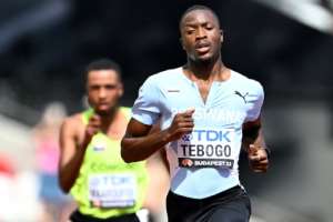 Letsile Tebogo leads a 200 metres heat during the 2023 world championships in Budapest..  By Jewel SAMAD (AFP)