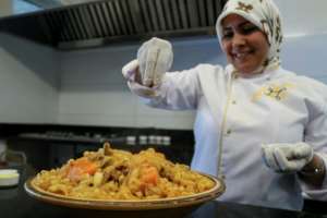 Libyan chef Monira Zwait prepares a coucous in the kitchen of her restaurant in Tripoli.  By Mahmud Turkia (AFP)