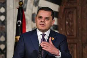 Libyas Tripoli-based Prime Minister Abdulhamid Dbeibah speaking at a joint press conference in Tunisias capital.  By FETHI BELAID (AFP/File)
