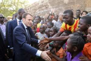Macron said on a trip to Burkina Faso in November that Europe needed to right historical wrongs by giving African artefacts back.  By ludovic MARIN (AFP/File)