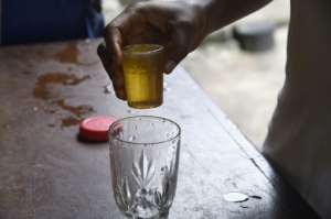 Make mine an ogogoro: The beverage is often infused with herbs that are said to have medicinal benefits.  By PIUS UTOMI EKPEI (AFP)