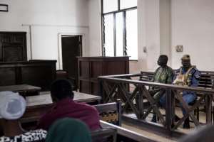 Manjang sits in the dock at the High Court in Banjul.  By Muhamadou BITTAYE (AFP)