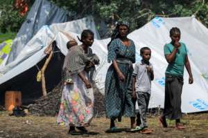 Many Ethiopian refugees are living in basic conditions with plastic sheeting for shelter in Sudan.  By ASHRAF SHAZLY (AFP)