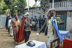 Many of the actors sport flamboyant costumes accessorised with wigs and other accoutrements.  By Daniel BELOUMOU OLOMO (AFP)