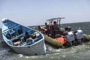 Mauritanias coastguard conduct patrols and check fishing boats for documents and permits.  By PATRICK MEINHARDT (AFP)