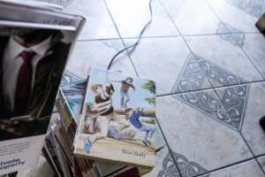 Mazibuko seeded The Book Cafe with 30 of his own books but now it overflows with hundreds of donations.  By EMMANUEL CROSET (AFP)
