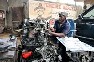 Mechanic Yacouba Sylla says he would need resources and state support to run a fully compliant workshop on which he pays taxes.  By Issouf SANOGO (AFP)