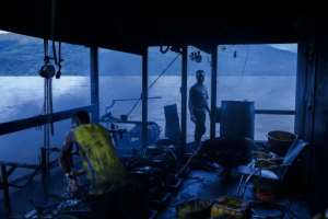 Mechanics work to repair the metal whaler on the Congo River.  By Arsene Mpiana (AFP)
