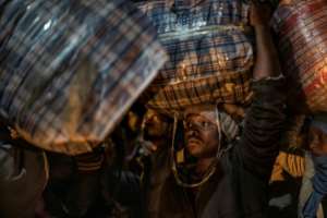 More than 160,000 migrants left in a matter of weeks, most of them Malawians and Zimbabweans.  By MARCO LONGARI (AFP)