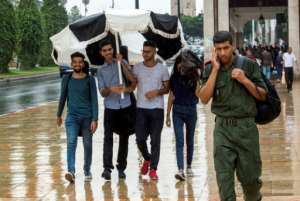 Moroccan youth and a soldier in the capital Rabat on September 12, 2018.  By FADEL SENNA (AFP)