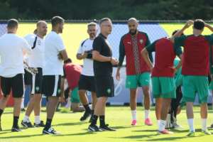Morocco boast a potent mix of technical quality, physicality and tactical nous under the guidance of coach Mohamed Ouahbi (C).  By Odd ANDERSEN (AFP)