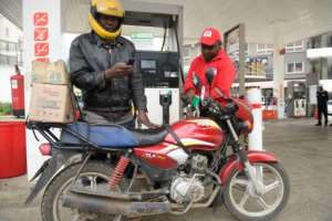 Motorbike courier Josiah Burudi holds that President William Ruto has reneged on his promise to improve the lives of ordinary Kenyans.  By SIMON MAINA (AFP)