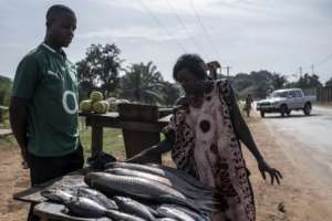 Much of the population has traditionally relied on the availability of large quantities of fish at cheap prices.  By Barbara DEBOUT (AFP)