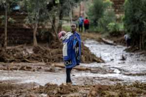 Nearly 50 villagers died when the makeshift dam burst in Kenyas Rift Valley.  By LUIS TATO (AFP)