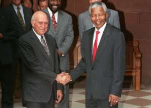 Nelson Mandela seen with F.W. de Klerk, the president who negotiated an end to white minority rule in South Africa. The pair were awarded the Nobel Peace Prize in December 1993.  By Philip LITTLETON (AFP/File)