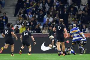 New Zealands wing Rieko Ioane dives across the line to score a try against the Stormers in Cape Town.  By Rodger Bosch (AFP)