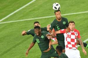 Nigerias defender William Troost-Ekong heads the ball over Croatias forward Mario Mandzukic during the Russia 2018 World Cup Group D football match at the Kaliningrad Stadium in Kaliningrad on June 16, 2018.  By Attila KISBENEDEK (AFP)